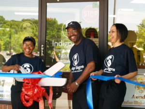The Walkers cut the ribbon in front of their image360® center in Tucker, GA.